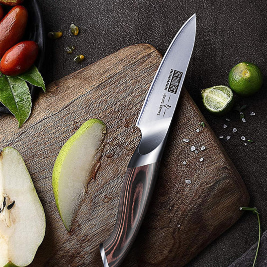 Couteau d'office japonais Hoshanho Loong Series lame inox manche pakkawood – découpe poire et citron vert sur planche bois
