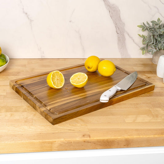 Planche à découper bois acacia rainure jus poignée avec citron