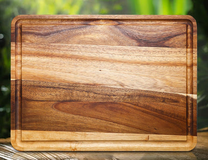 Planche à découper bois acacia rainure jus poignée – vue de face fond naturel vert