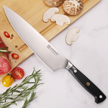 Couteau chef Keemake lame large acier inoxydable avec manche noir et légumes frais