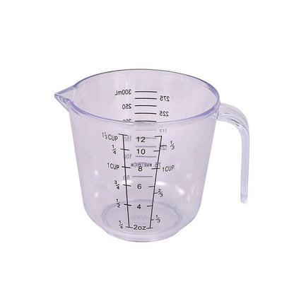 Verre doseur transparent — poignée ergonomique